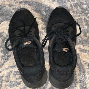 Women’s Black and Gold Nike shoes